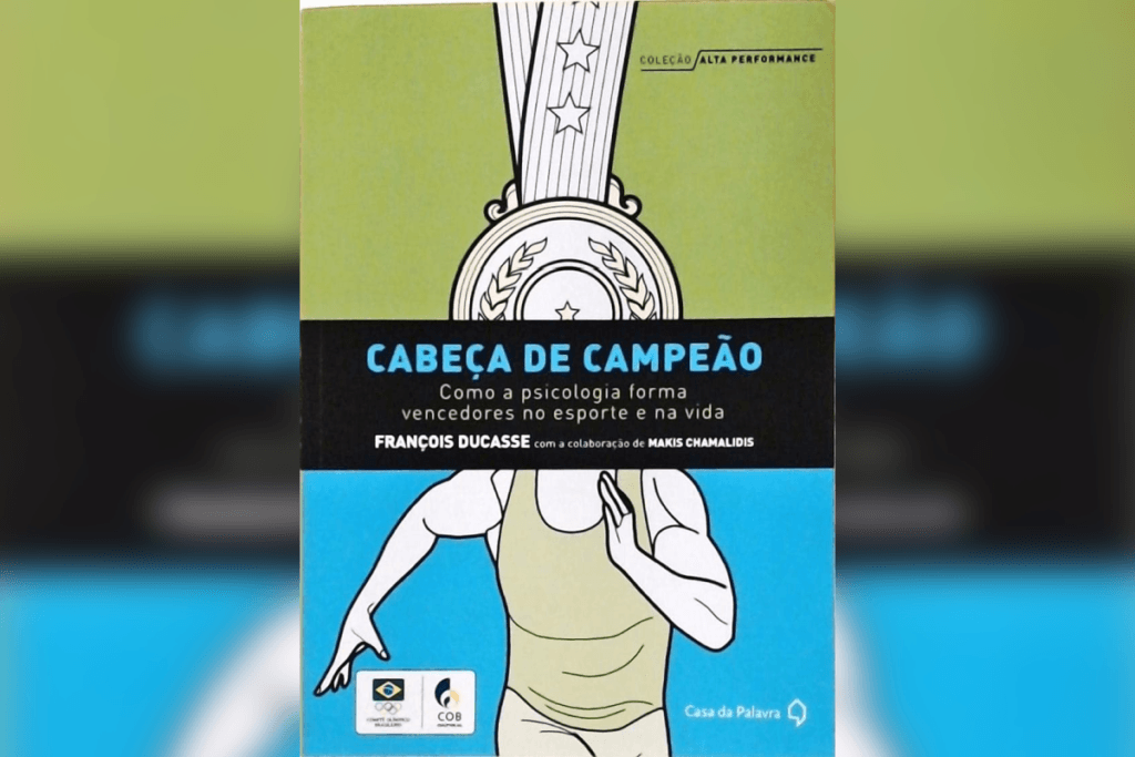 Capa do livro “Cabeça de Campeão”, com ilustração de atleta e medalha, fundo verde e azul
