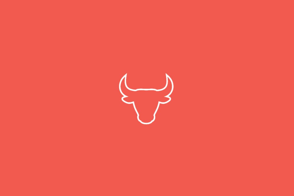 Ilustração do signo de Touro em fundo vermelho, com a cabeça de um touro de chifres curvados