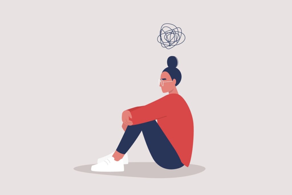 Ilustração de uma jovem sentada no chão usando sapato branco, calça preta e blusa vermelha e com um circulo de rabisco em cima da cabeça em fundo cinza