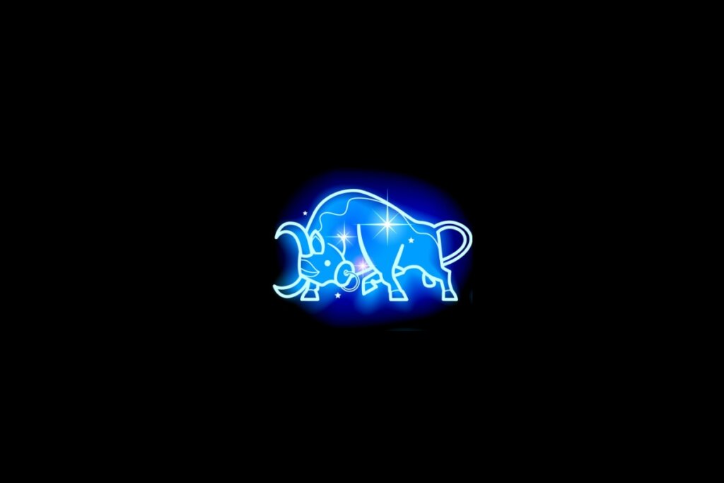 Ilustração do signo de touro em azul sobre um fundo preto