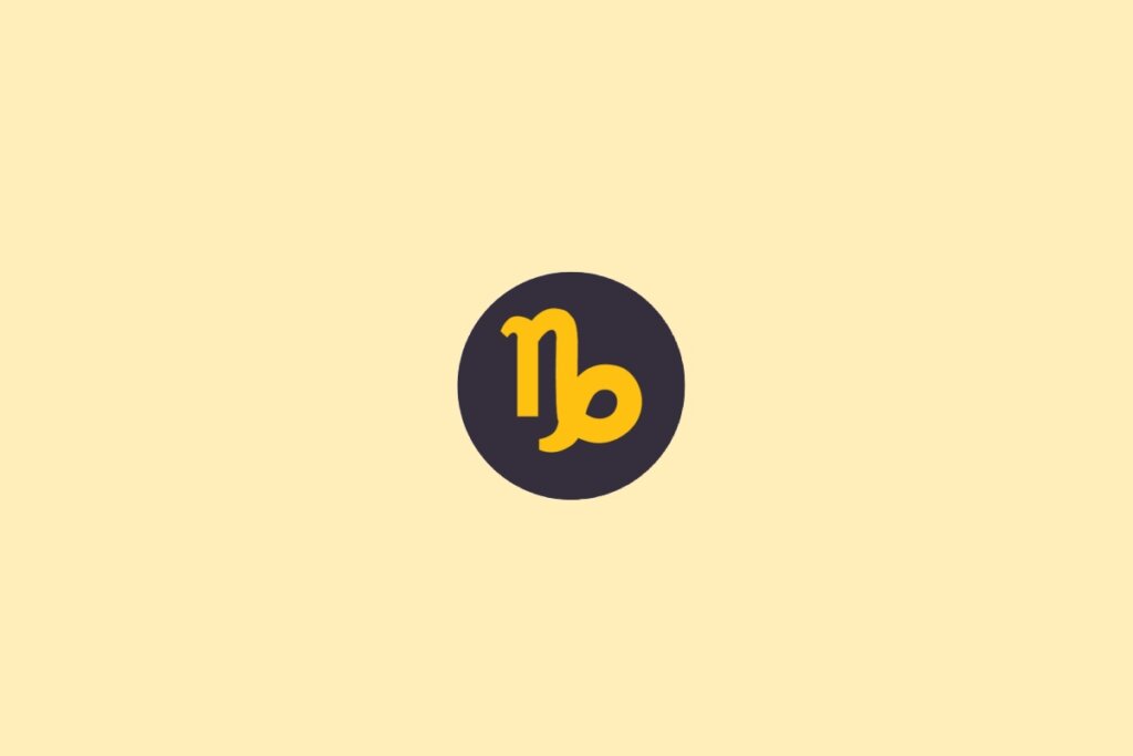 Um símbolo do signo de Capricórnio em amarelo, dentro de um círculo escuro, sobre um fundo claro bege