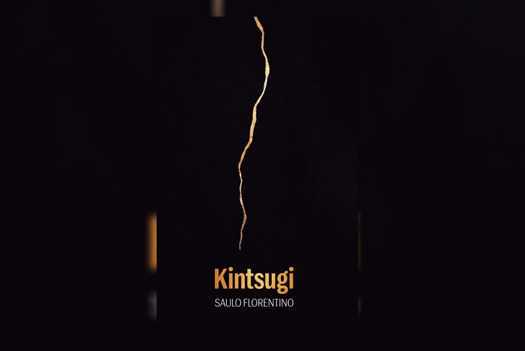 Capa do livro "Kintsugi", com um fundo preto e um raio dourado no meio 