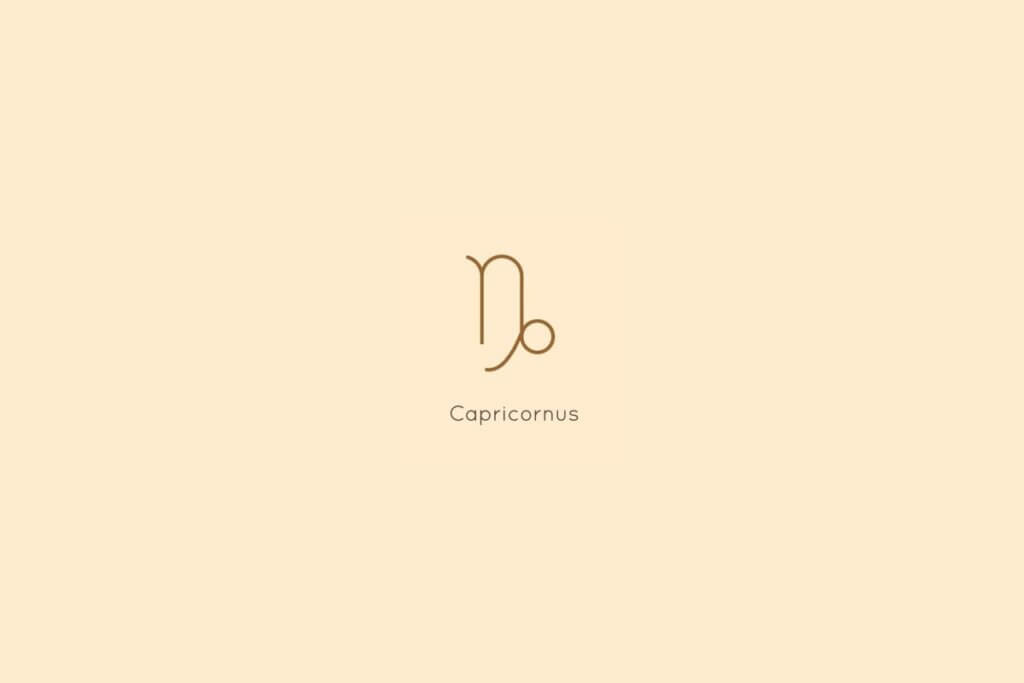 Ilustração do signo de capricórnio, centralizado em um fundo amarelo, com o nome do signo abaixo