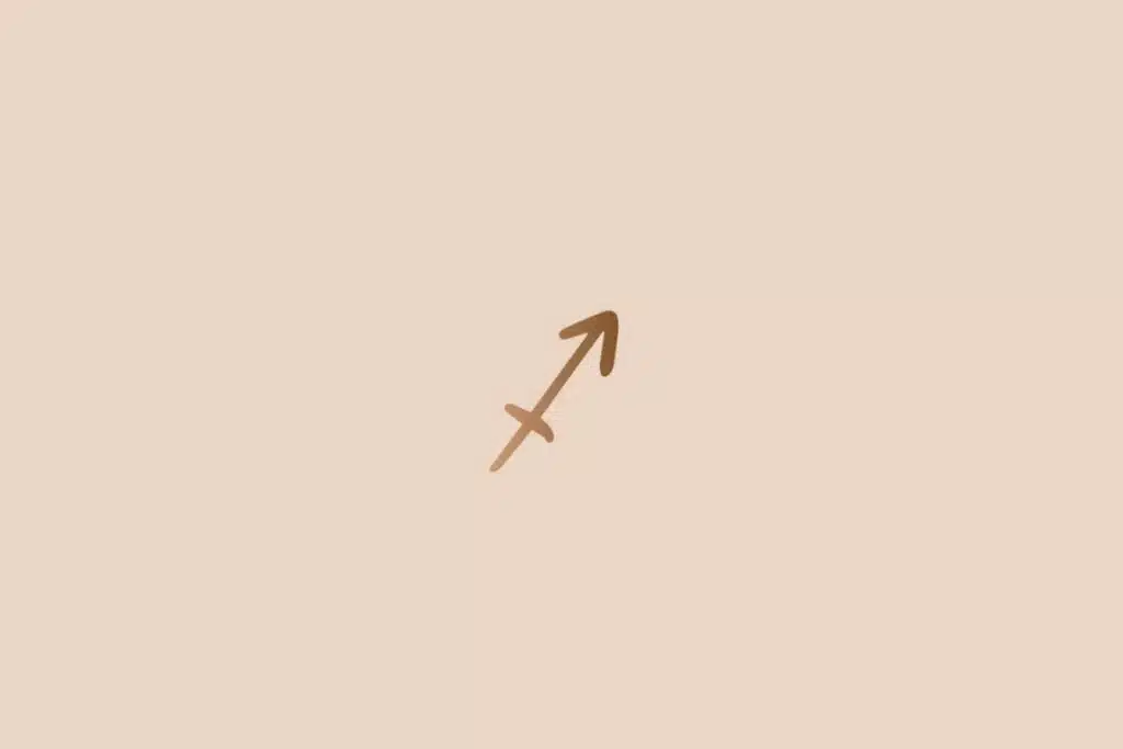 Ilustração do signo de sagitário na cor marrom em um fundo bege-claro