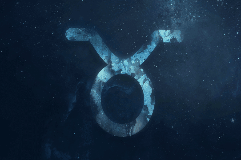 A imagem mostra o símbolo do signo de touro em destaque sobre um fundo que representa o espaço, repleto de estrelas e nebulosas. O ícone aparece em tons de azul, com textura que se mistura ao cenário cósmico.