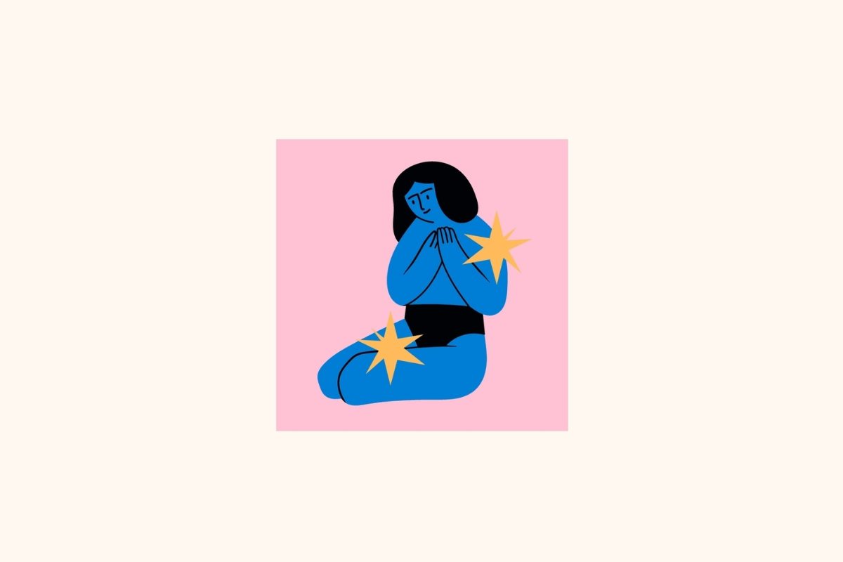 Ilustração estilizada do signo de Virgem centralizada em um quadrado rosa sobre fundo creme, retratando uma mulher de pele azul-cobalto, cabelos pretos e vestindo roupas pretas, sentada dobrada com as mãos no peito, acompanhada por duas estrelas amarela-douradas ao lado do braço e sobre as pernas