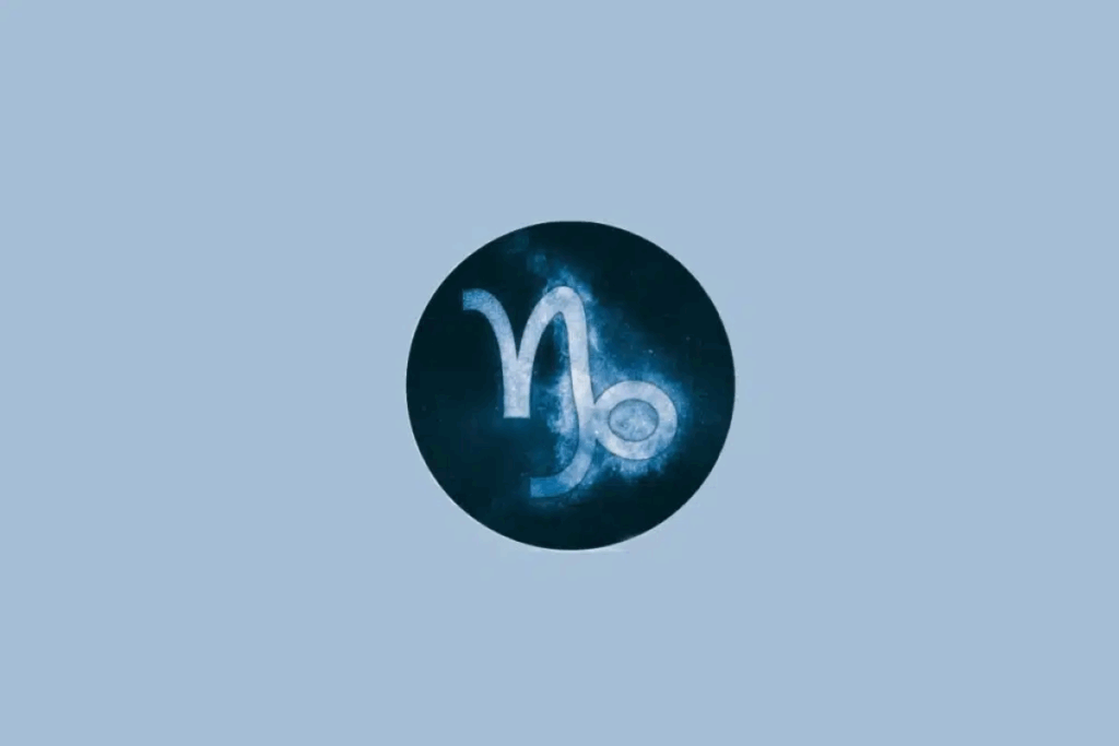 Ilustração do símbolo do signo de Capricórnio em azul-claro, com textura cósmica e efeito luminoso, centralizado em um círculo azul-escuro sobre um fundo azul-claro.